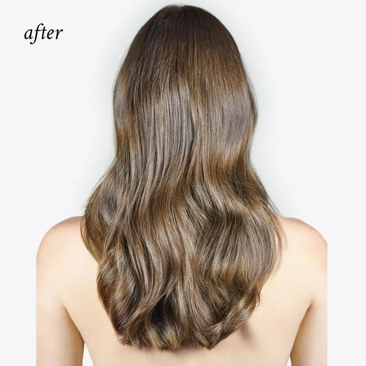 Woman's hair showing silky, shiny effect after using Oi Liquid Luster treatment for glassy finish.