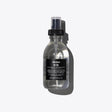 Davines Oi Oil bottle for enhancing hair shine and reducing frizz, ideal for coarse or dry hair, 135ml in a spray bottle.