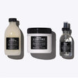 Oi Set featuring shampoo, conditioner, and oil for shiny, aromatic hair suitable for all types.