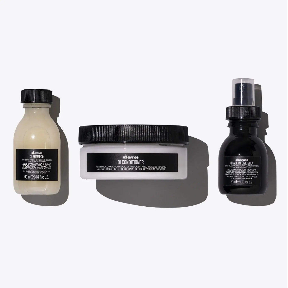 OI Travel Set with Shampoo, Conditioner, and All in One Milk for nourishing all hair types, perfect for travel and shine.