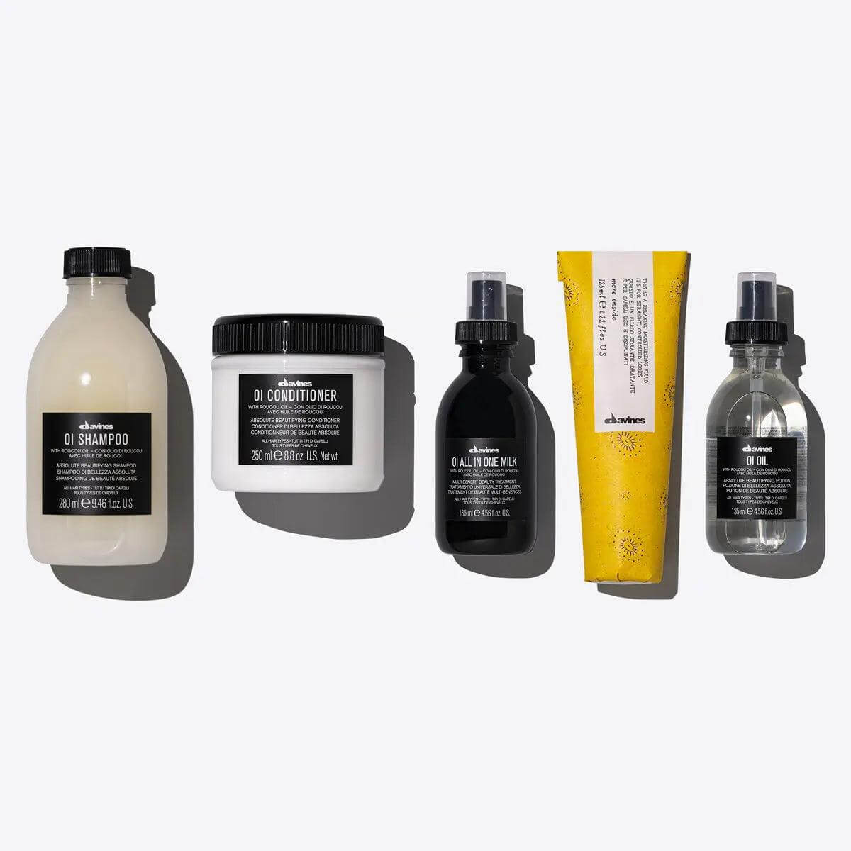 Davines OI Oil Control Set featuring shampoo, conditioner, all-in-one milk, and oil for shine and softness.