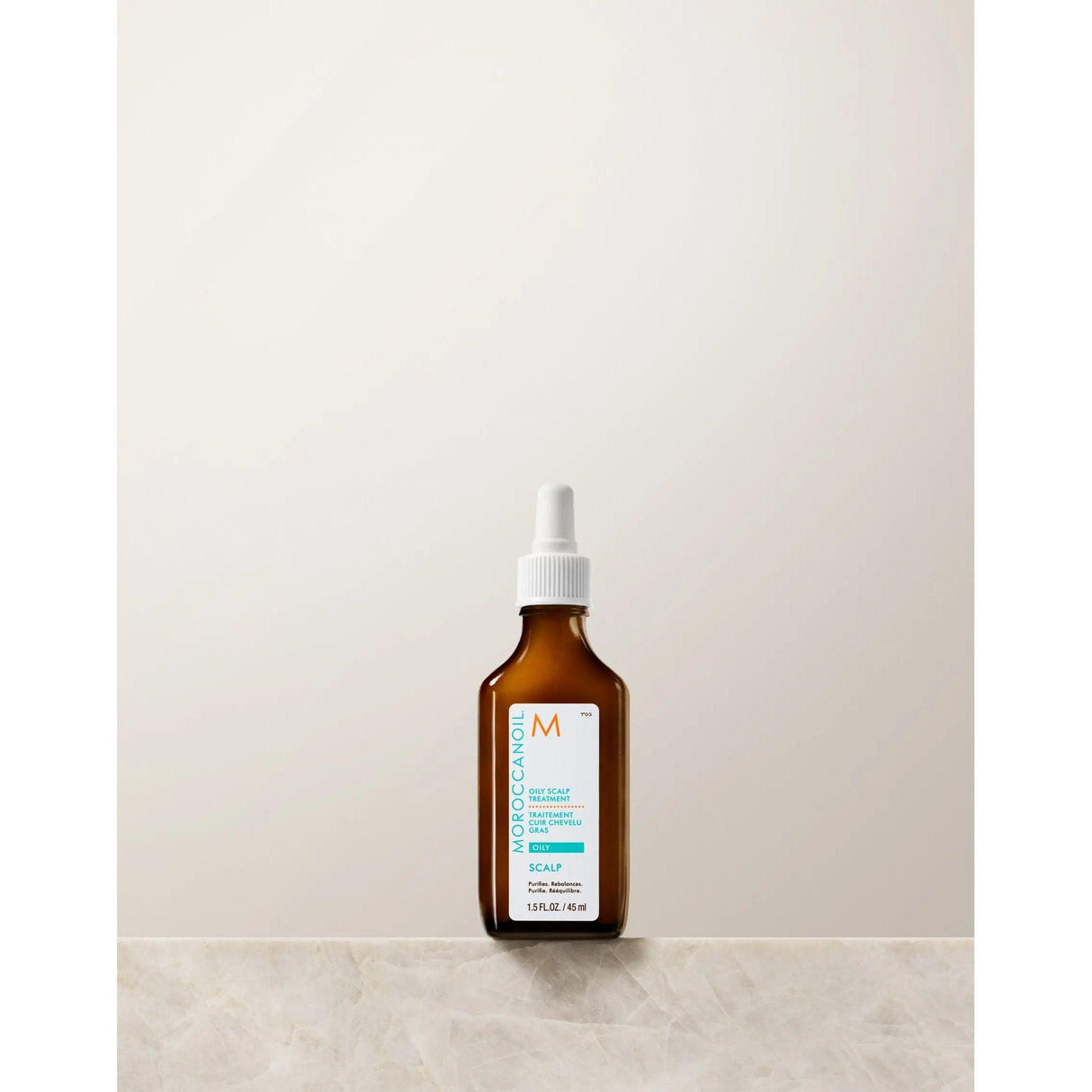 Moroccanoil Oil-No-More Scalp Treatment bottle for oily hair care, featuring ginger oil and purifying agents.