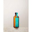 Moroccan Oil Original Hair Treatment bottle with argan oil for silky, smooth hair. Repairs split ends and reduces frizz.