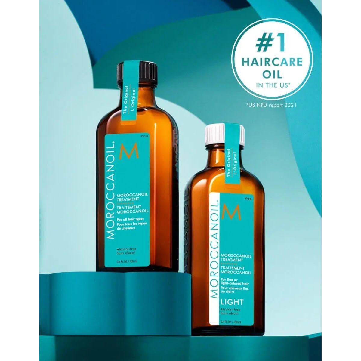Alt Tag: Moroccan Oil Original Hair Treatment bottles with argan oil for silky, smooth hair, repairing split ends and taming frizz.