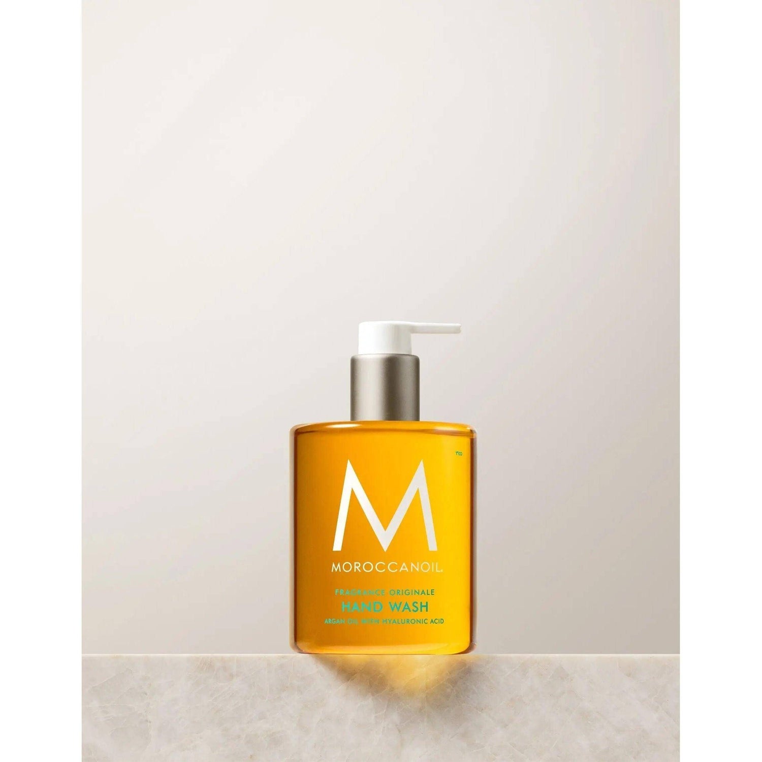 "Originale Fragrance Hand Wash bottle with argan oil and hyaluronic acid, featuring Moroccan-inspired design, in recyclable packaging."