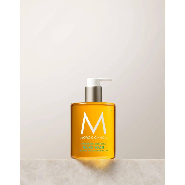 "Originale Fragrance Hand Wash bottle with argan oil and hyaluronic acid, featuring Moroccan-inspired design, in recyclable packaging."