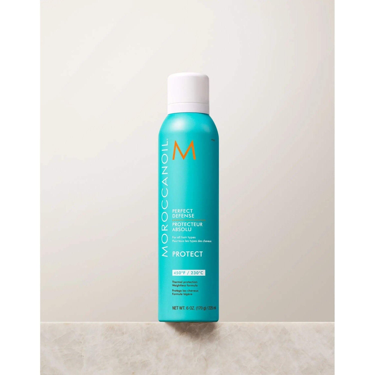Perfect Defense Heat Protectant spray bottle with argan oil, protects hair from heat up to 450°F and ideal for layering styling products.