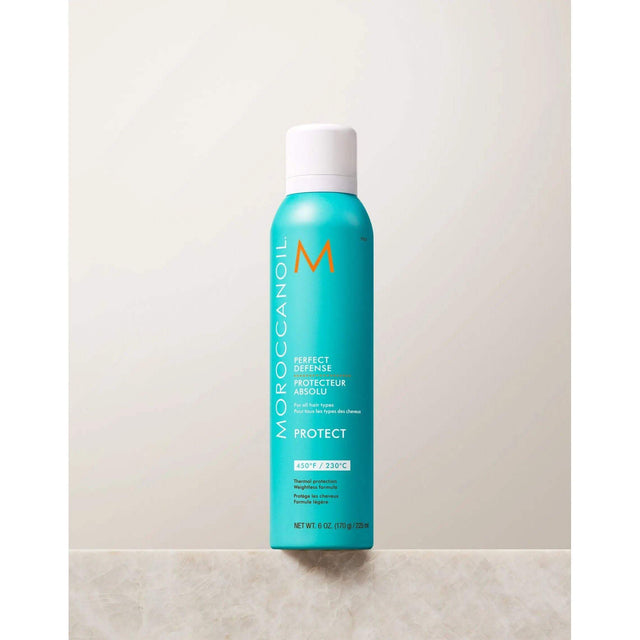 Perfect Defense Heat Protectant spray bottle with argan oil, protects hair from heat up to 450°F and ideal for layering styling products.