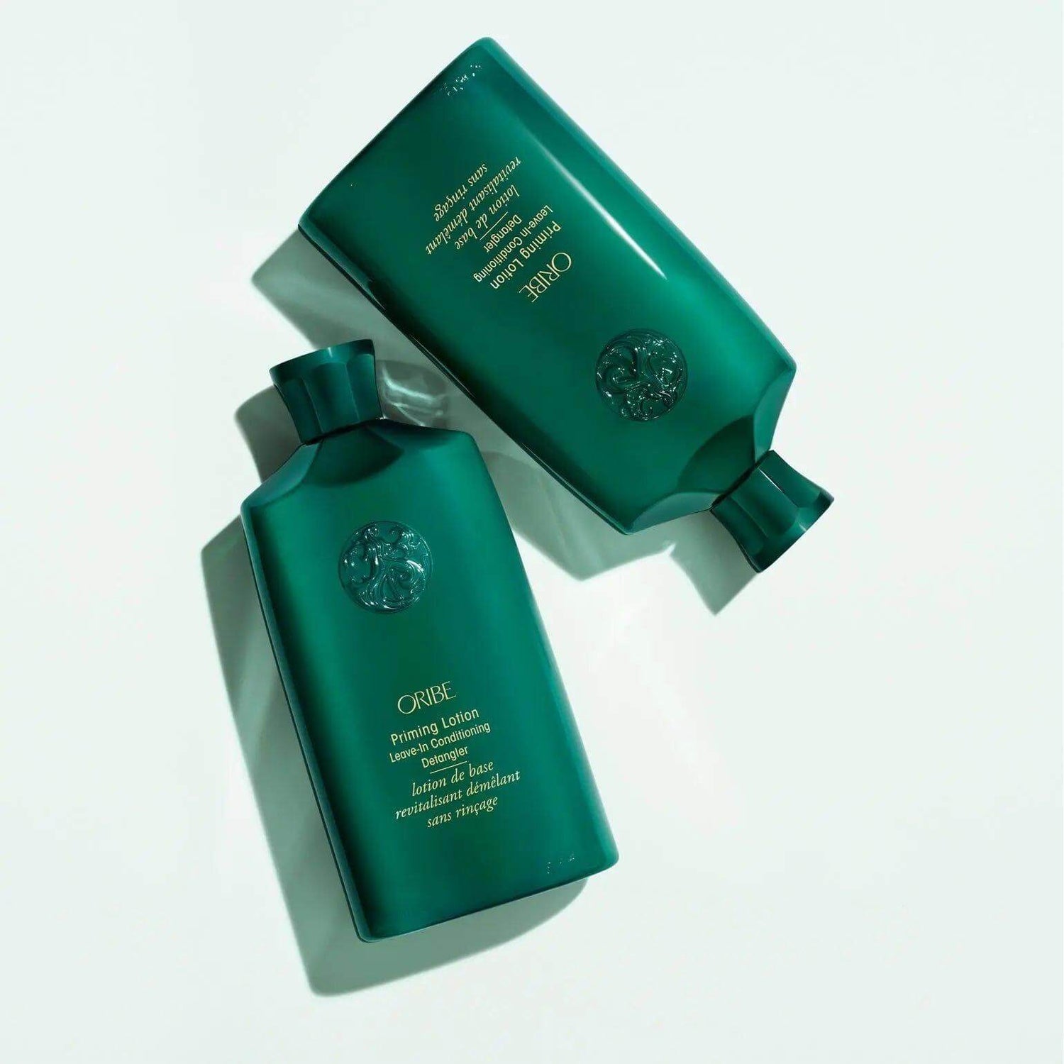 Priming Lotion Leave-In Conditioning Detangler bottles for curly hair care featuring cupuacu and mango seed butter.