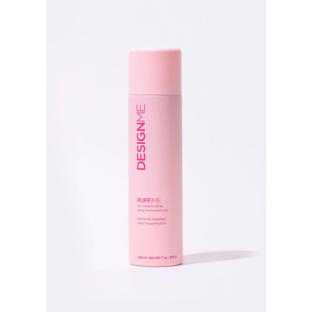 Puff.Me Dry Texture Spray for instant volume and light texture, flexible hold, in a pink bottle - designed by DESIGNME.