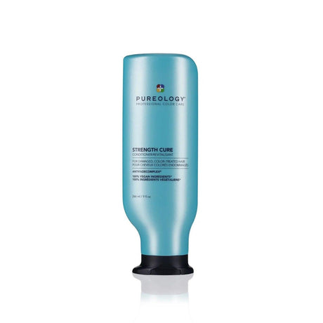Pureology Strength Cure Conditioner bottle for repairing damaged hair with Asta-Repair and antioxidants.