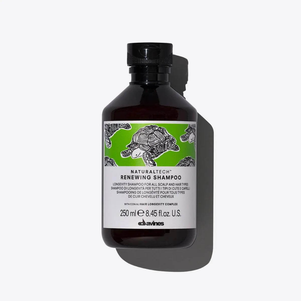 "Bottle of Naturaltech Renewing Shampoo for scalp and hair longevity, 250 ml size, enhances softness and volume."