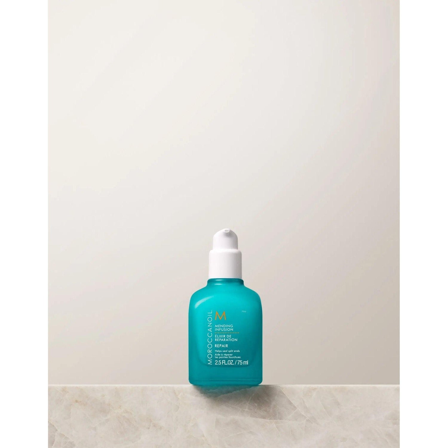 Moroccanoil Repair Mending Infusion bottle for nourishing split ends, controls frizz, suitable for all hair types and textures.