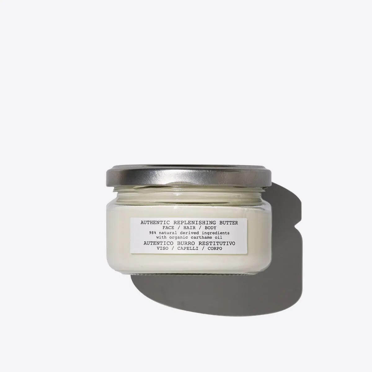 Jar of Replenishing Butter for skin and hair, offering deep hydration and nourishment with natural ingredients.