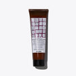 Replumping Conditioner tube, designed to strengthen and moisturize hair, featuring a grid pattern label, 150ml bottle.