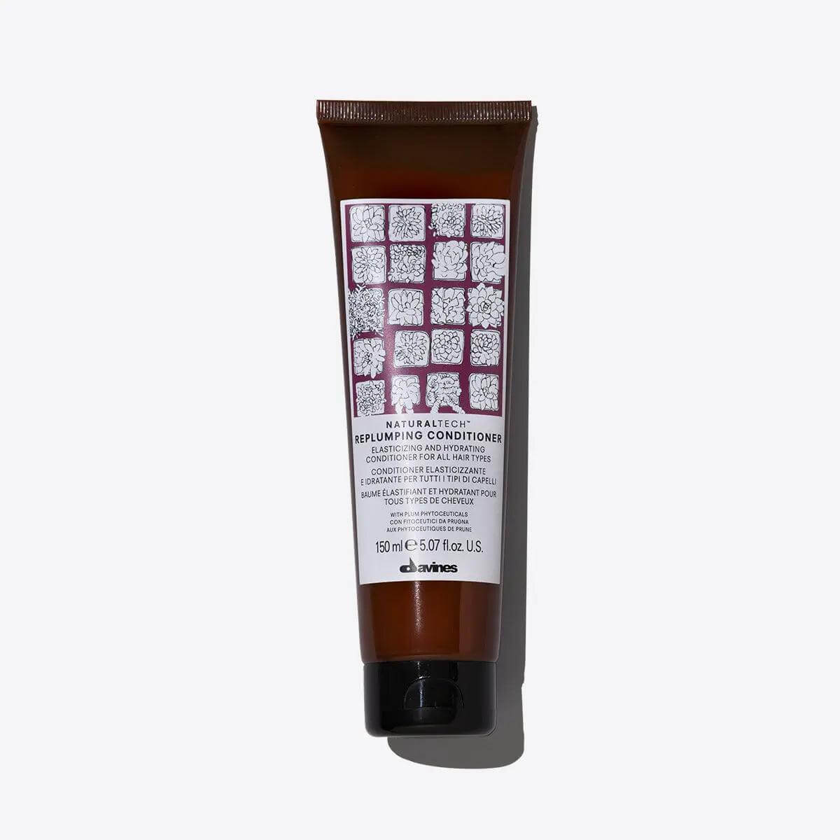 Replumping Conditioner tube, designed to strengthen and moisturize hair, featuring a grid pattern label, 150ml bottle.