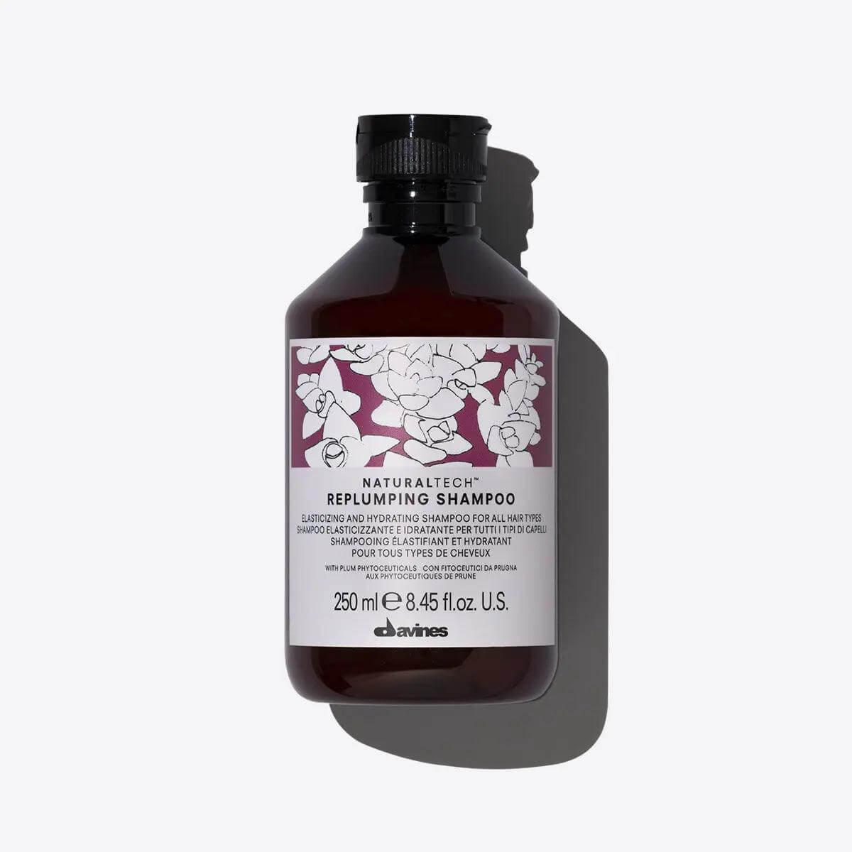 Alt Tag: Bottle of Naturaltech Replumping Shampoo for elasticity and hydration, 250 ml, by Davines, ideal for enhancing hair structure.
