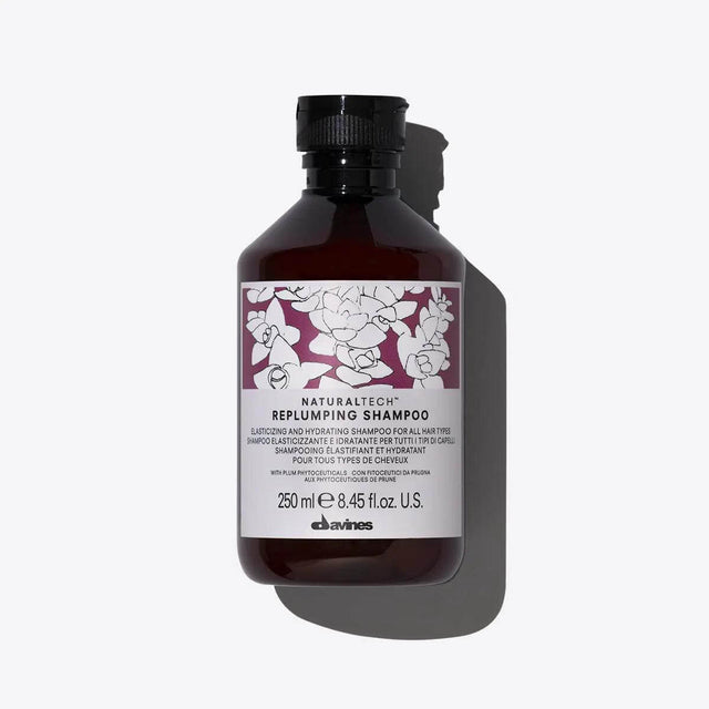 Alt Tag: Bottle of Naturaltech Replumping Shampoo for elasticity and hydration, 250 ml, by Davines, ideal for enhancing hair structure.