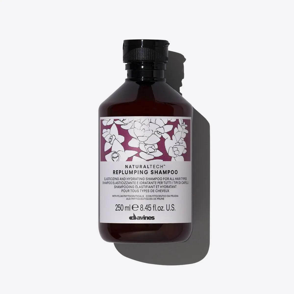 Davines Replumping Shampoo bottle, elasticizing and moisturizing formula for gentle cleansing without altering hair structure.