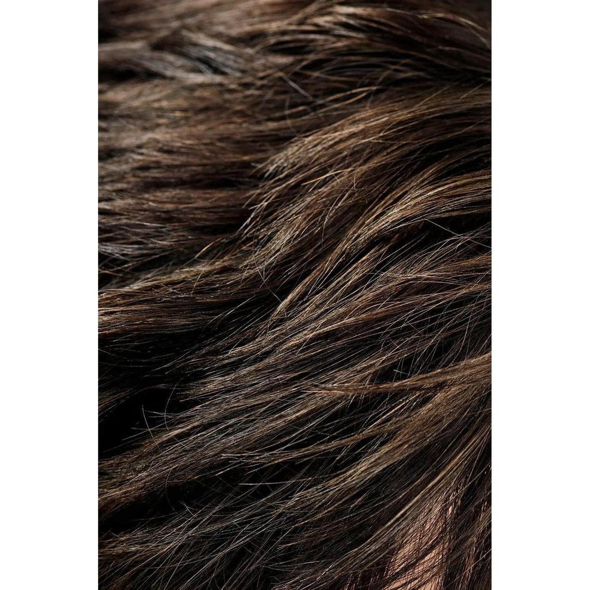 Close-up of textured hair styled with Rough Luxury Soft Molding Paste, showcasing shine and flexible hold.