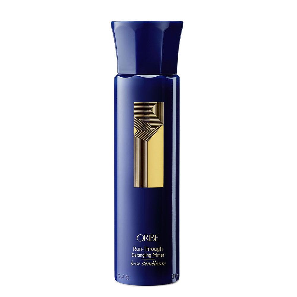 Oribe Run-Through Detangling Primer for sleek, soft hair in medium to thick textures, 175ml bottle - Lightweight hair primer.