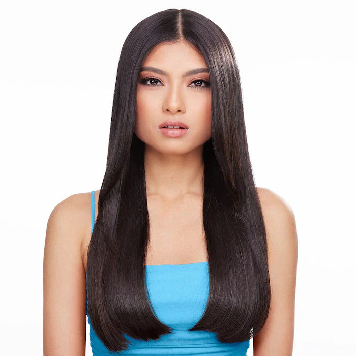 Woman with glossy, frizz-free straight hair after using Dream Coat Supernatural Spray