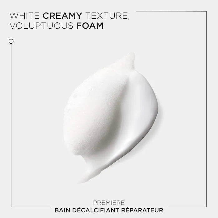 Alt Tag: White creamy texture of Bain Décalcifiant Réparateur Shampoo foam for damaged hair.