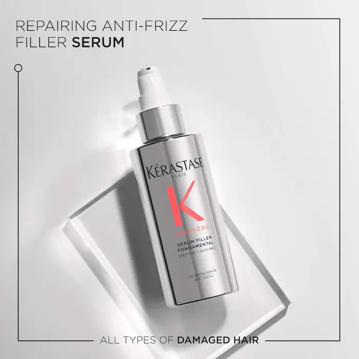Kérastase Sérum Filler Fondamental bottle for repairing anti-frizz, damaged hair on a reflective surface.