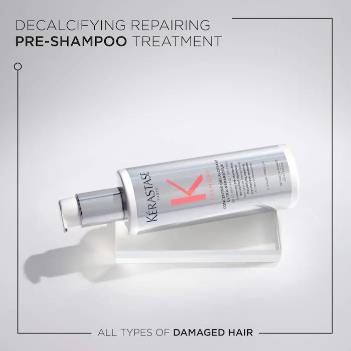 Concentré Ultra-Réparateur Hair Treatment bottle for damaged hair pre-shampoo on white background. Decalcifying and repairing treatment.