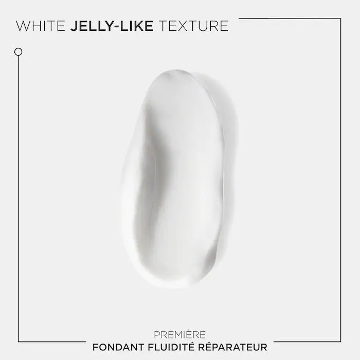 Fondant Fluidité Réparateur Conditioner with white jelly-like texture for damaged hair repair and moisture revitalization.