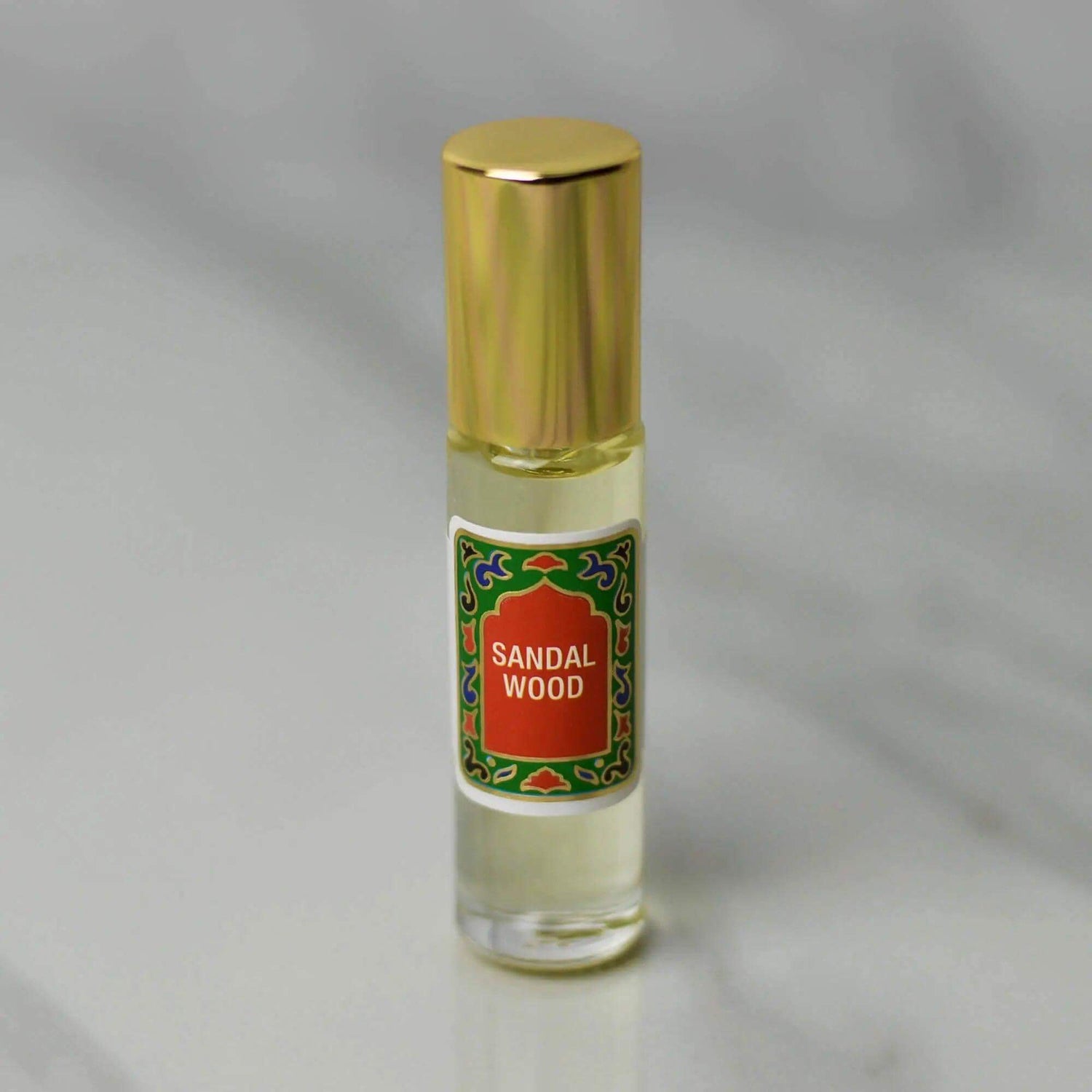 Sandalwood Roll-On Perfume 10ml with gold cap, featuring woodsy and rose aroma, alcohol-free fragrance with sustainable ingredients.
