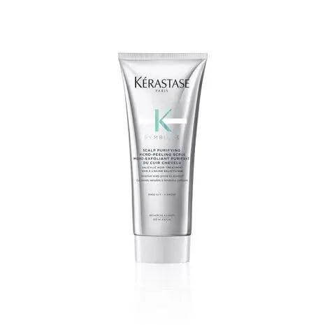 Kérastase Scalp Purifying Micro-Peeling Scrub bottle for exfoliating and revitalizing the scalp, suitable for all hair types and textures.