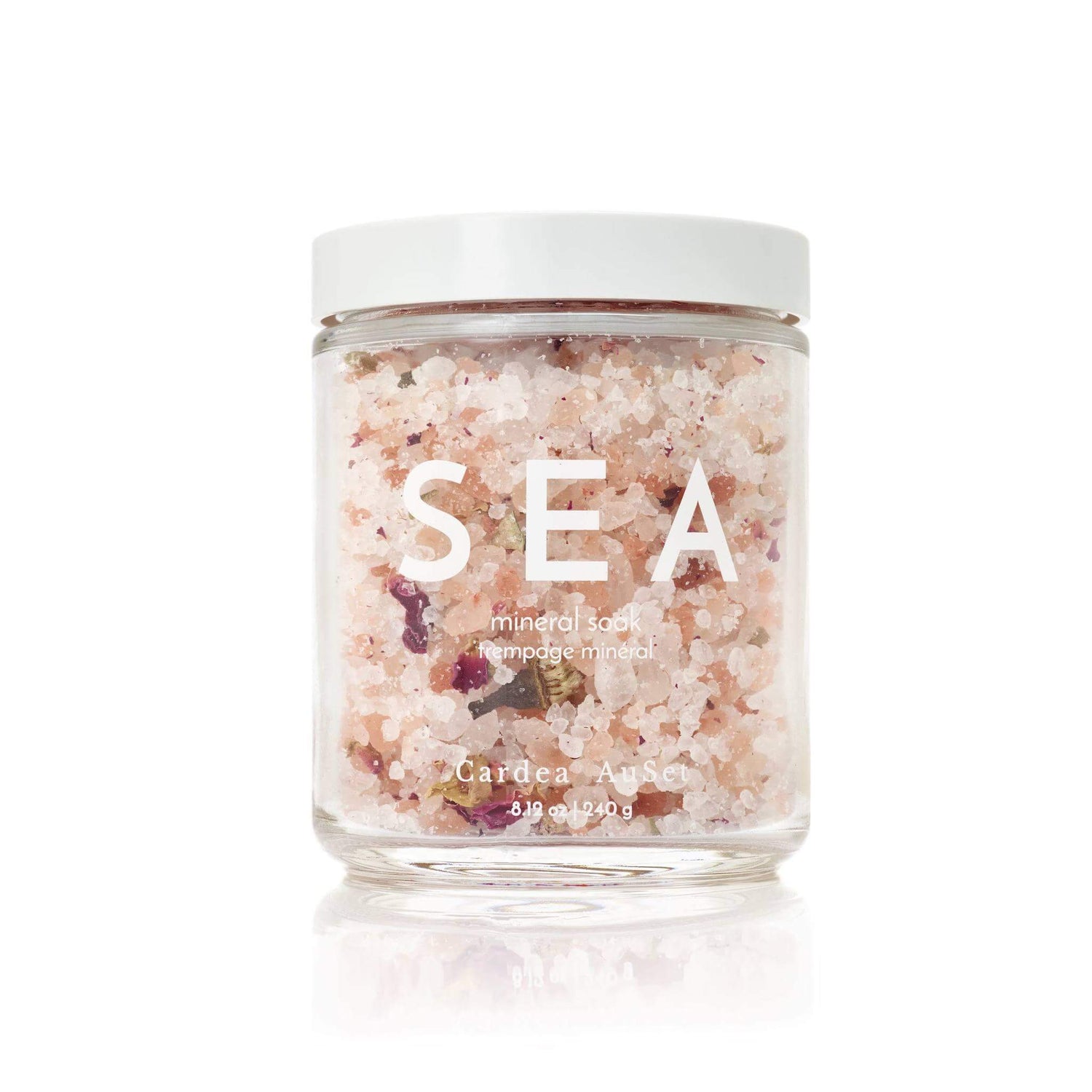 Jar of Sea Mineral Soak with sea salts and rose petals for skincare, relaxation, and stress relief.