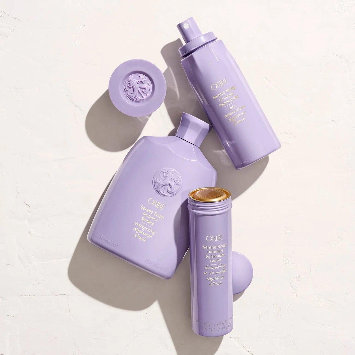 Serene Scalp Oil Control Dry Shampoo Powder bottles on a textured surface, ideal for refreshing hair and managing oily scalps.