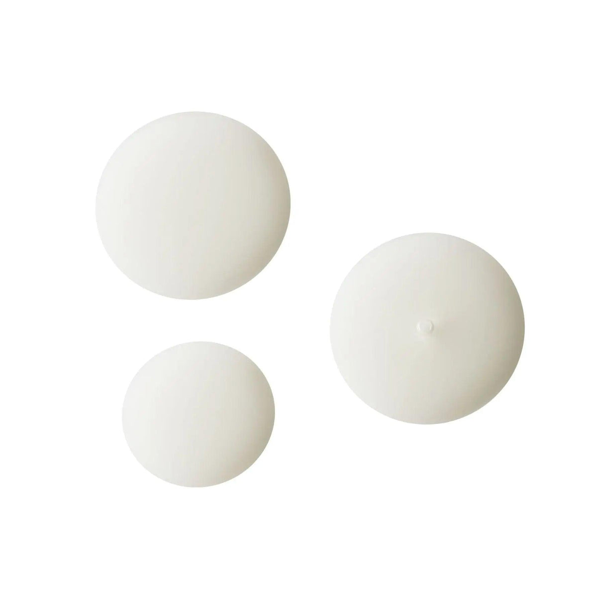 White serum droplets on white background showcasing Serum C20's texture for skincare.
