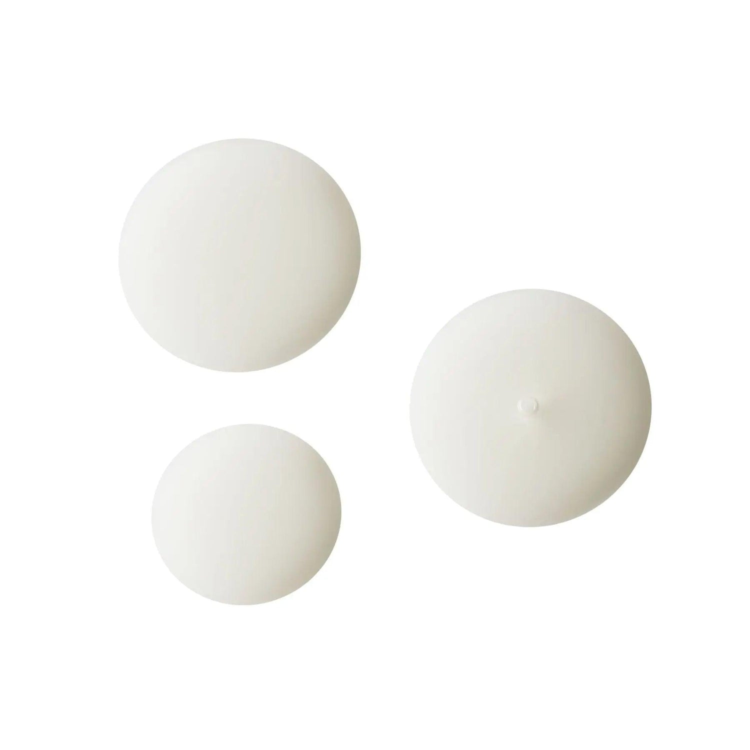 White serum droplets on white background showcasing Serum C20's texture for skincare.