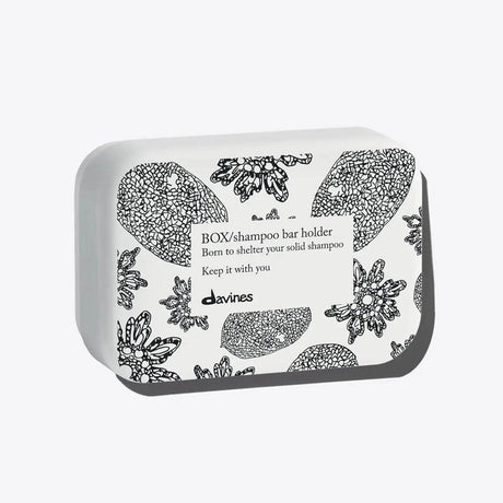 Aluminum shampoo bar case with floral design, durable and practical for storage, ensuring shampoo bars last longer.