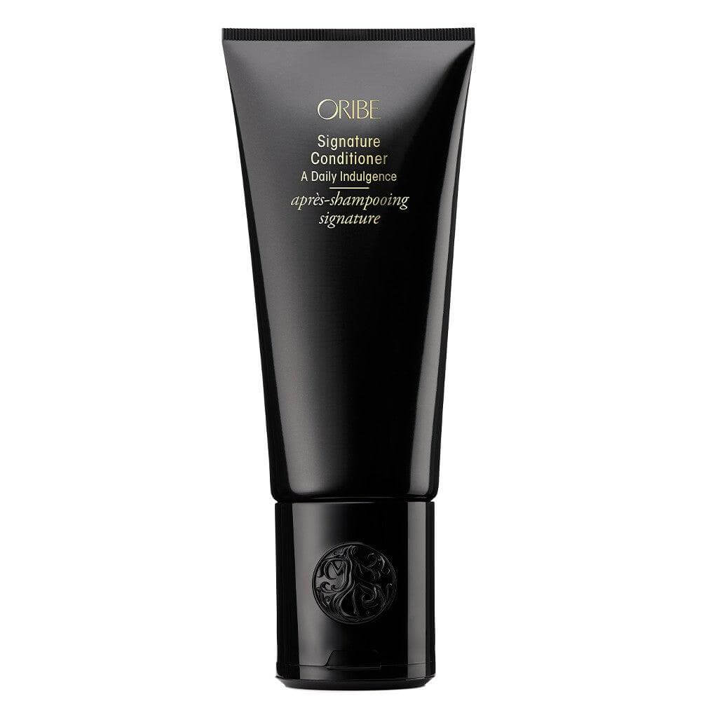 Signature Conditioner for men's hair, offering nourishment, hydration, and protection in a sleek black tube packaging.