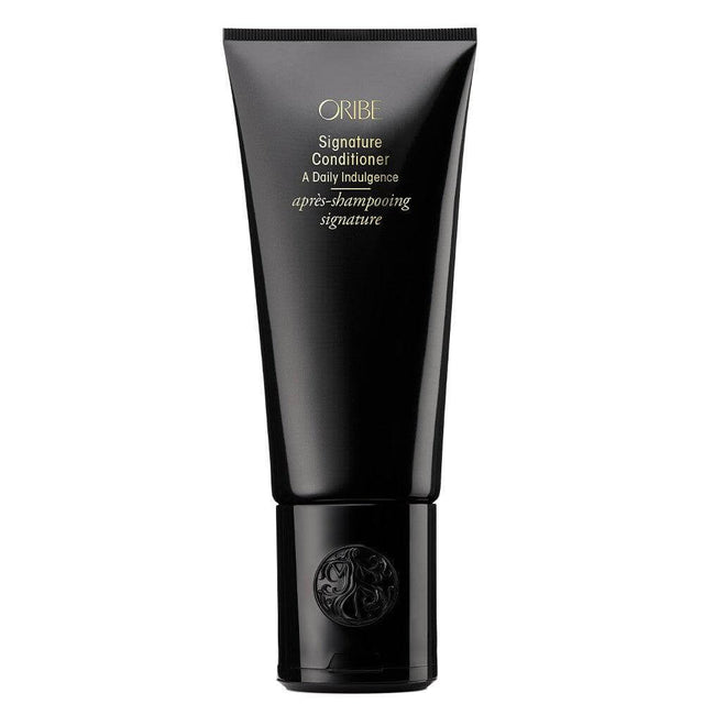 Signature Conditioner for men's hair, offering nourishment, hydration, and protection in a sleek black tube packaging.