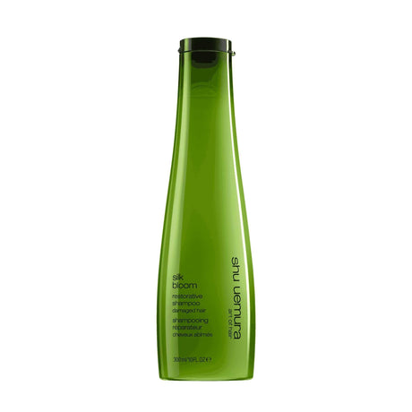 Shu Uemura Silk Bloom Shampoo bottle for repairing and fortifying dry, damaged hair.