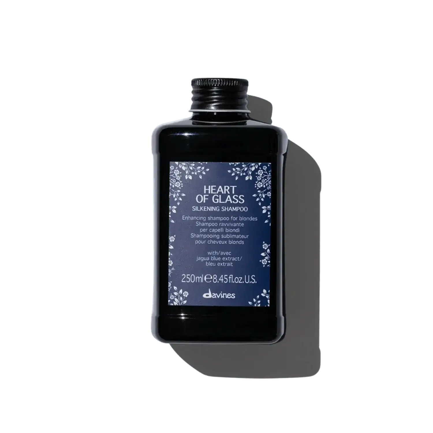 Bottle of Heart of Glass Silkening Shampoo for enhancing blonde hair with nourishing and clarifying formula, 250ml.