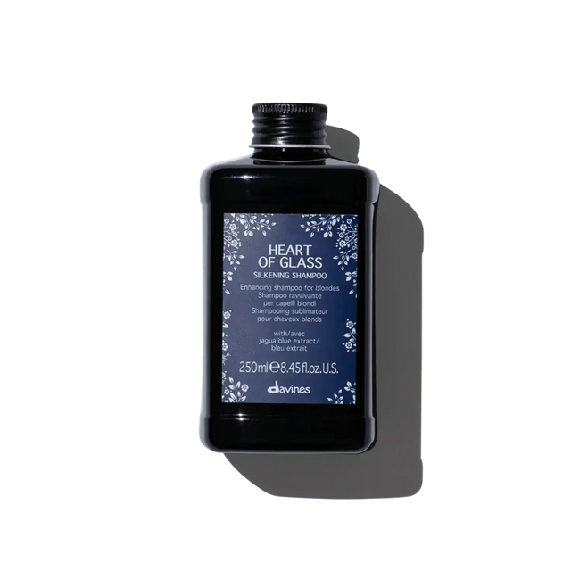 Bottle of Heart of Glass Silkening Shampoo for enhancing blonde hair with nourishing and clarifying formula, 250ml.