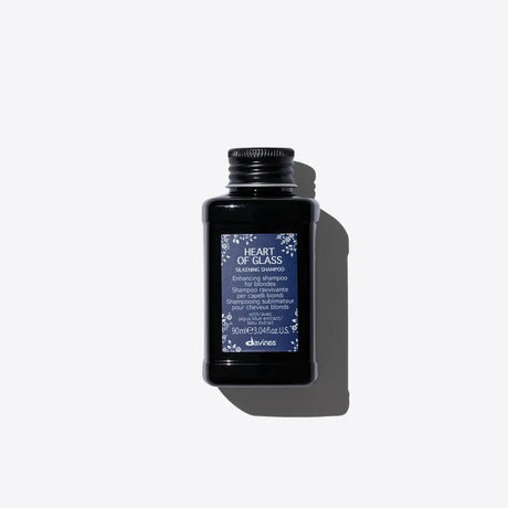 Silkening Shampoo bottle for enhancing blonde tones, suitable for natural and chemically treated hair. Mild and nourishing formula.