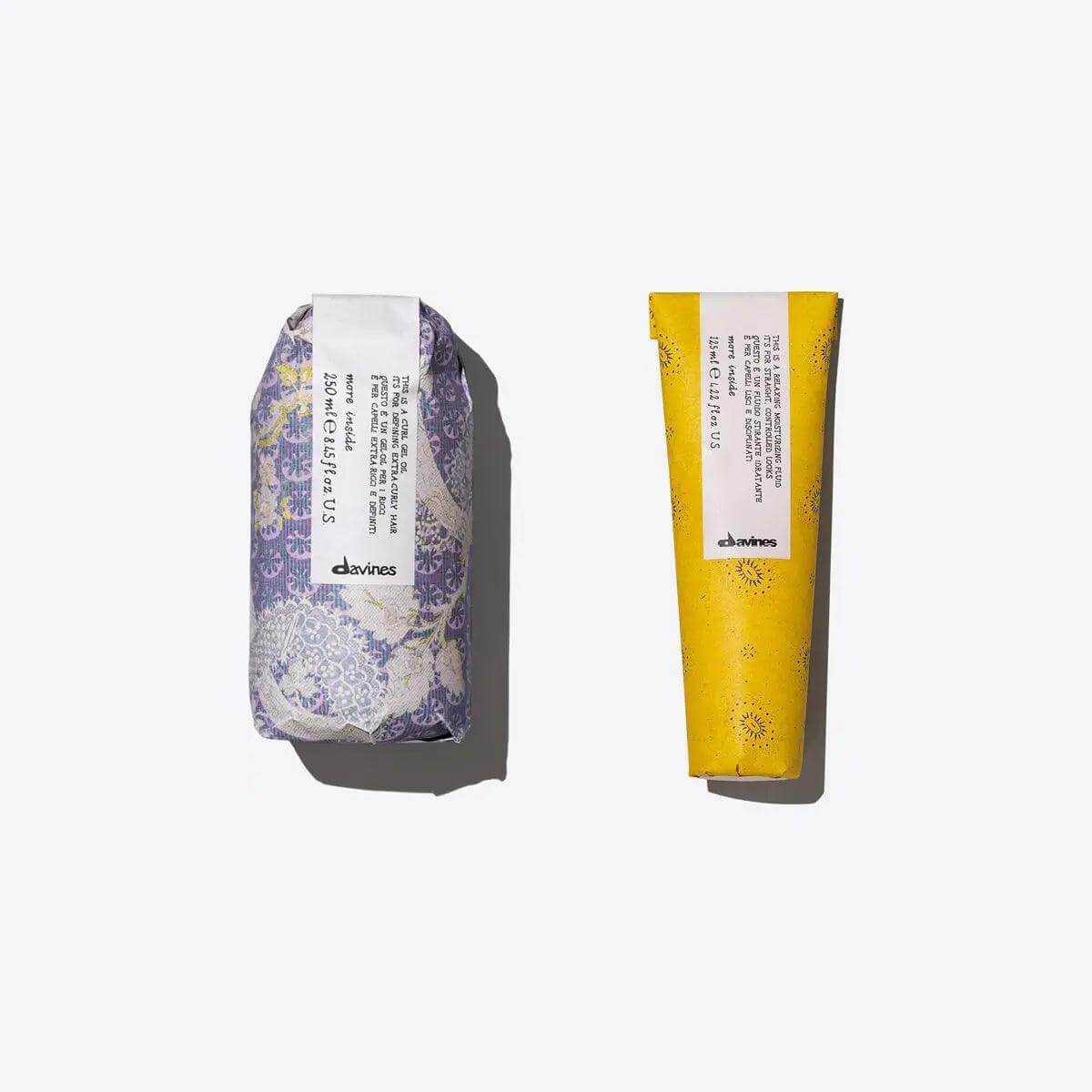 Smooth, Shaped, Curls Set with moisturizing fluid and curl gel oil for defined, relaxed curls. Two elegantly packaged hair care products.