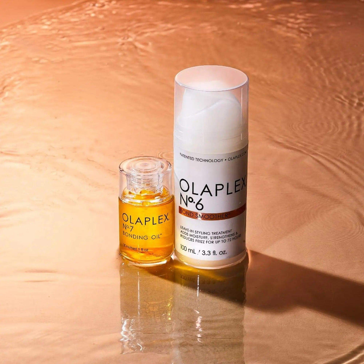 Smooth, Shine & Protect Kit featuring Olaplex Nº.6 Bond Smoother and Nº.7 Bonding Oil on a textured copper surface.