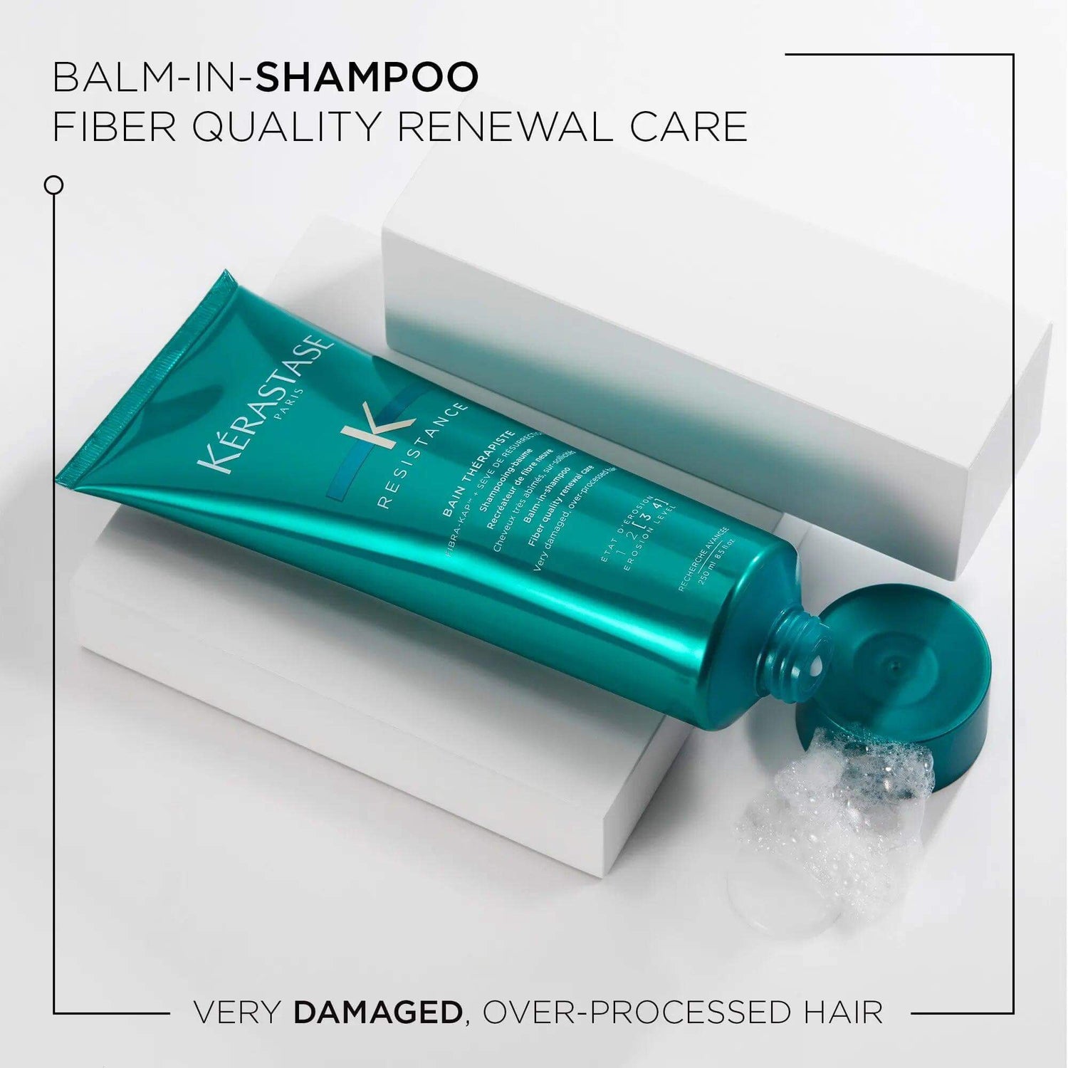 Alt Tag: Kérastase Soin Premium Therapiste balm-in-shampoo tube for damaged hair repair and renewal care on white blocks