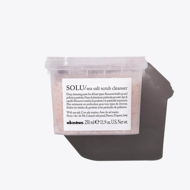 Solu Sea Salt Scrub Cleanser in clear container for deep scalp cleansing and hair revitalization.