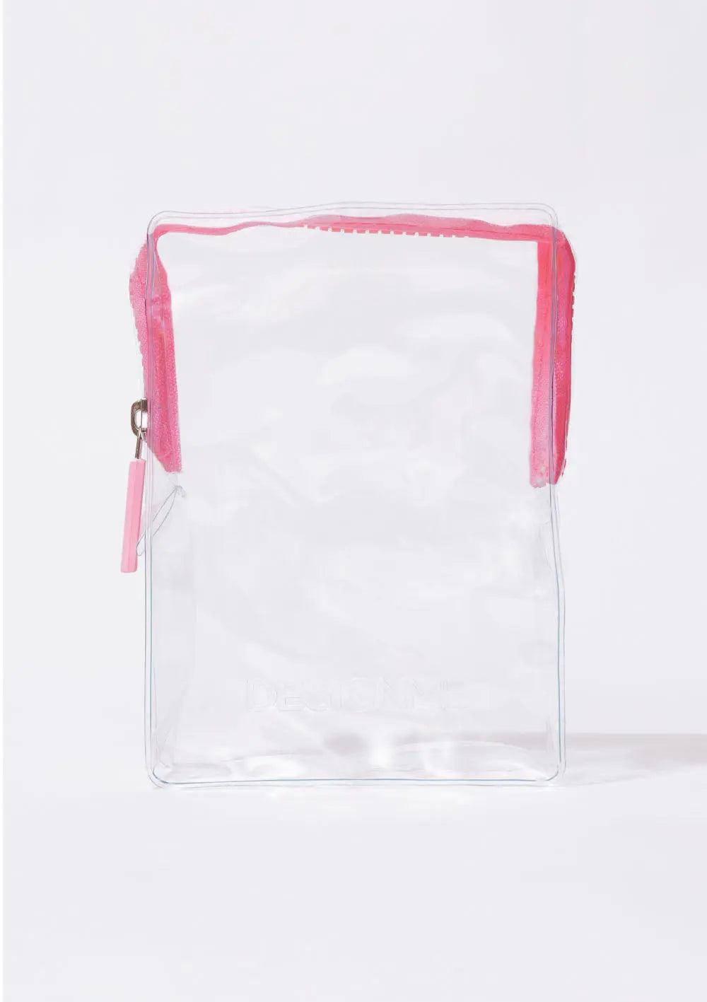 Clear cosmetic bag with pink zipper for the STYLE DISCOVERY KIT hair styling products.