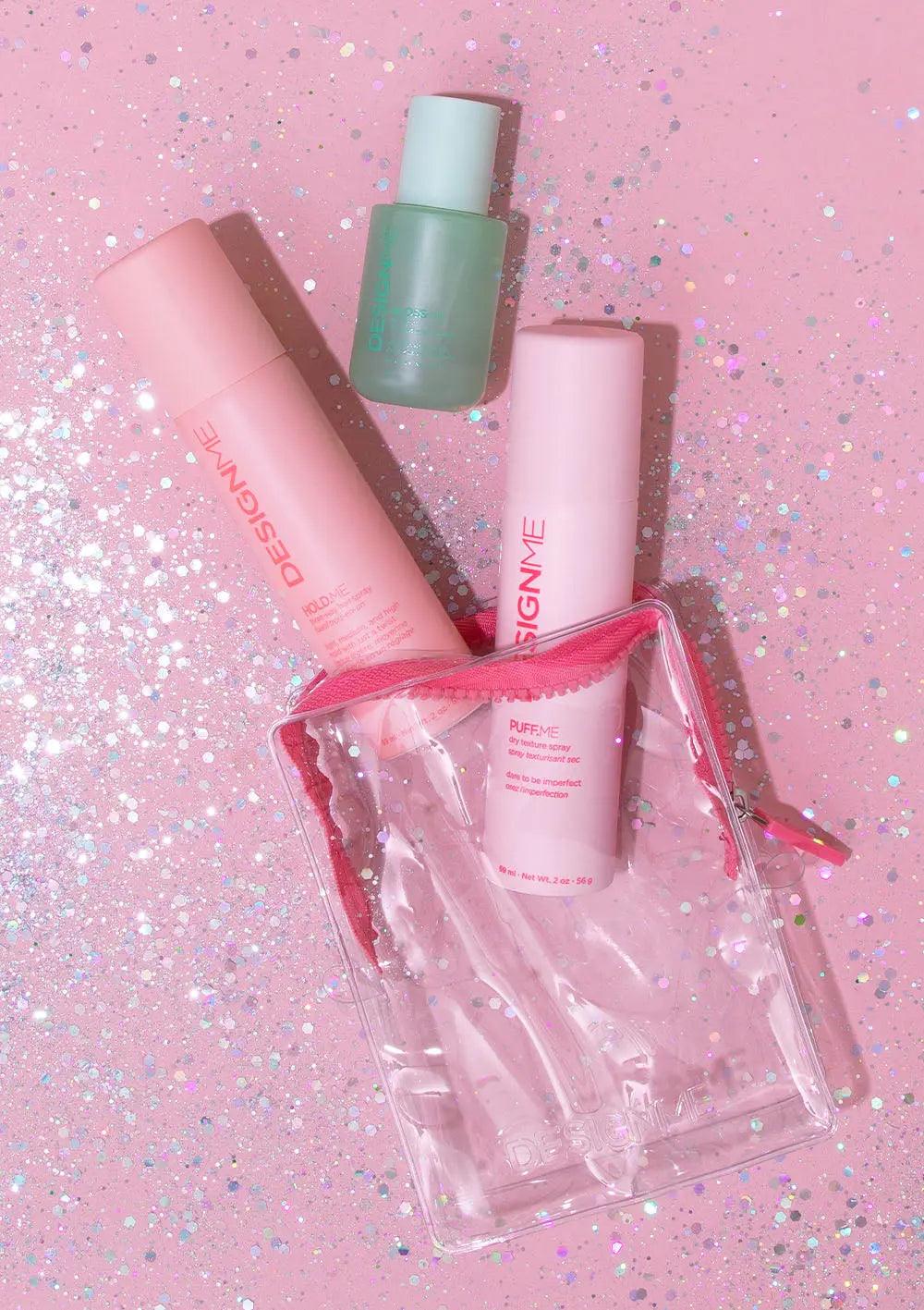 DESIGNME Style Discovery Kit featuring three mini styling products on a glittery pink background.