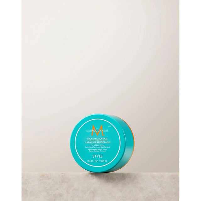 Molding Cream jar for hair styling with argan and olive oils for soft structure and definition.